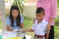 The doctor is taking blood from primary student.